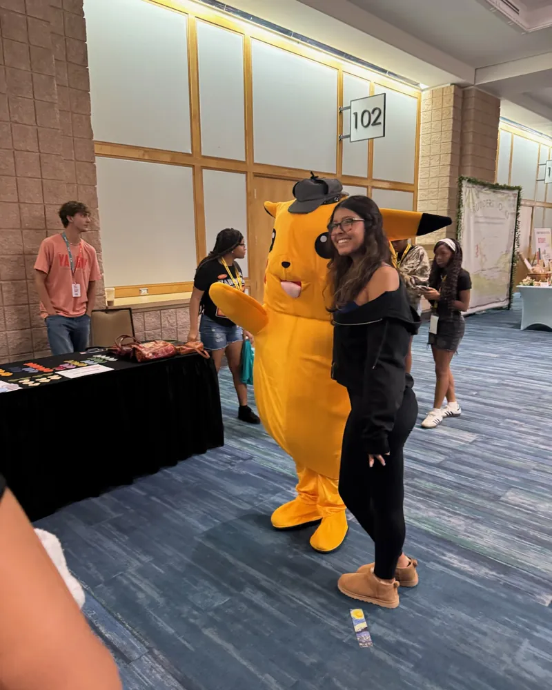 A student hugging the Pikachu mascot